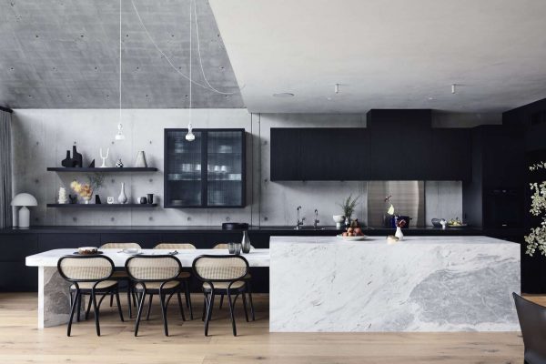 the-kitchen-island-and-attached-table-are-a-custom-design-in-a-natural-stone-called-elba-blue-marble